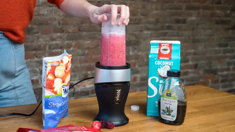 The Ninja personal blender blending a smoothie.