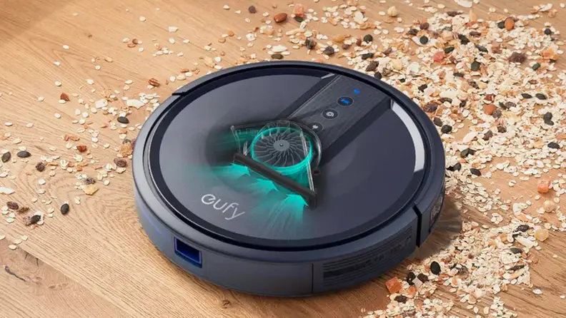 A robot vacuum sucks up crumbs.