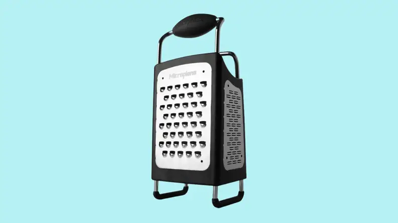 Box cheese grater against cyan background