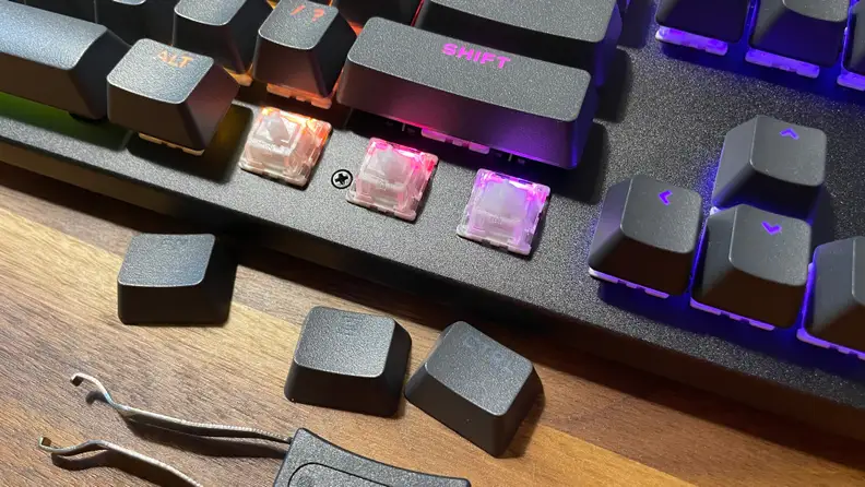 Three keys on the bottom of the Corsair K70 Max RGB keyboard being replaced.