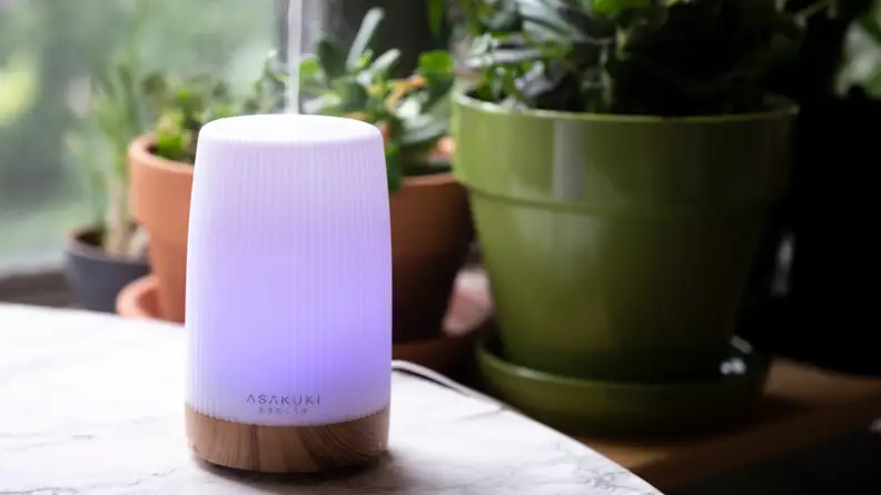 Asakuki Essential Oil Diffuser sitting on a table.
