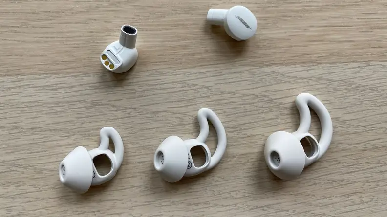 A Bose sleepbud taken apart to show the speaker unit and the silicone fitting that nestles in the ear