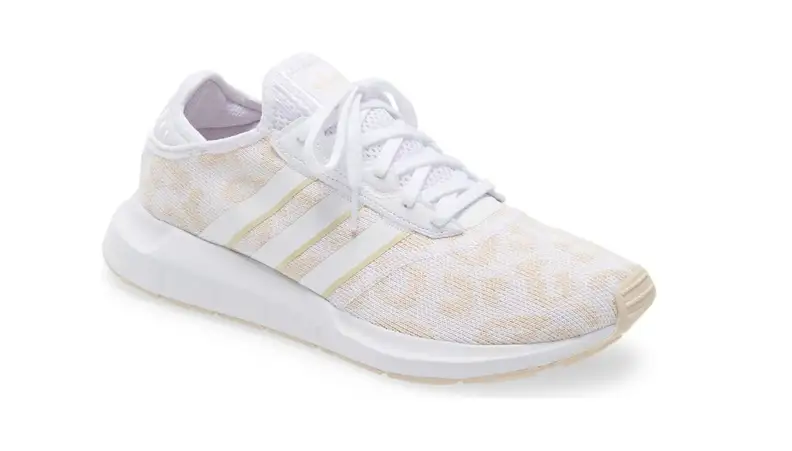 A white Adidas sneaker against a white background.