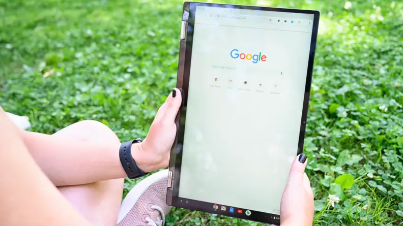 The Asus Chromebook C434TA held like a tablet