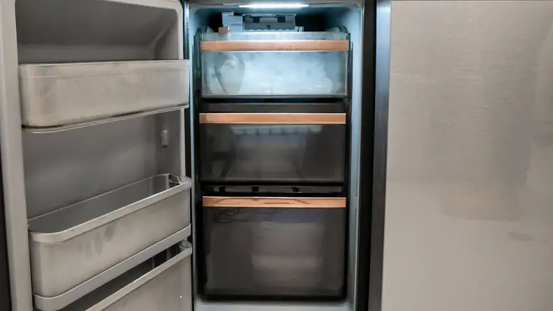 A close-up of the dedicated freezer compartment and its tilt-out door bins.