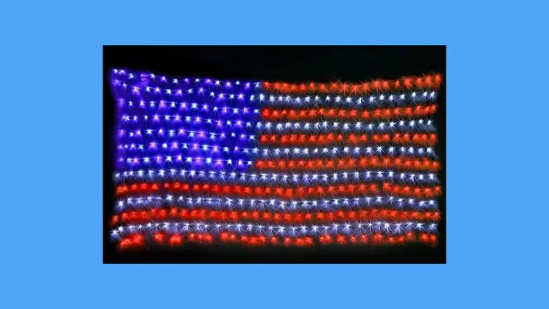 An LED American flag against a blue background.