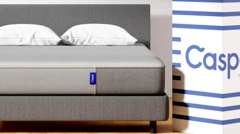 Casper mattress next to a white box that says Casper