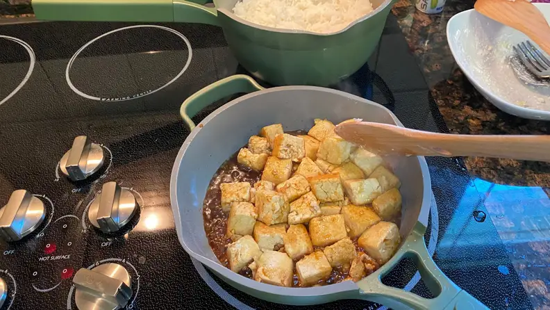 Always Pan cooking some fried tofu.