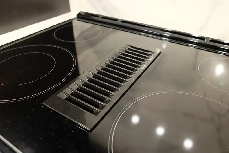 The new downdraft vent on an electric range
