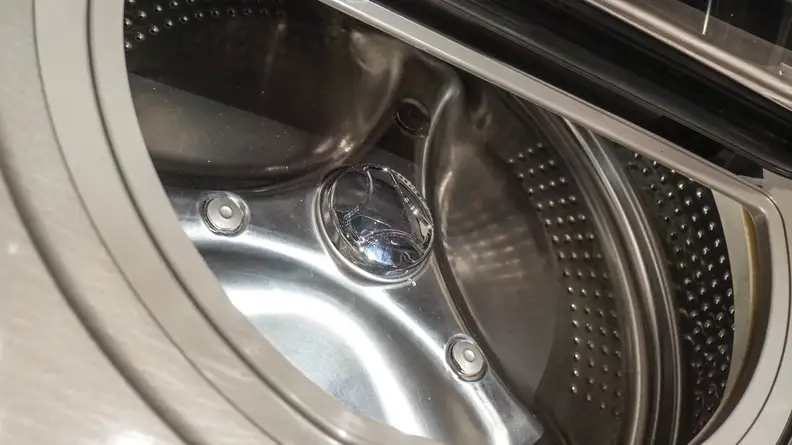 The stainless steel interior is designed to be gentle on clothing.