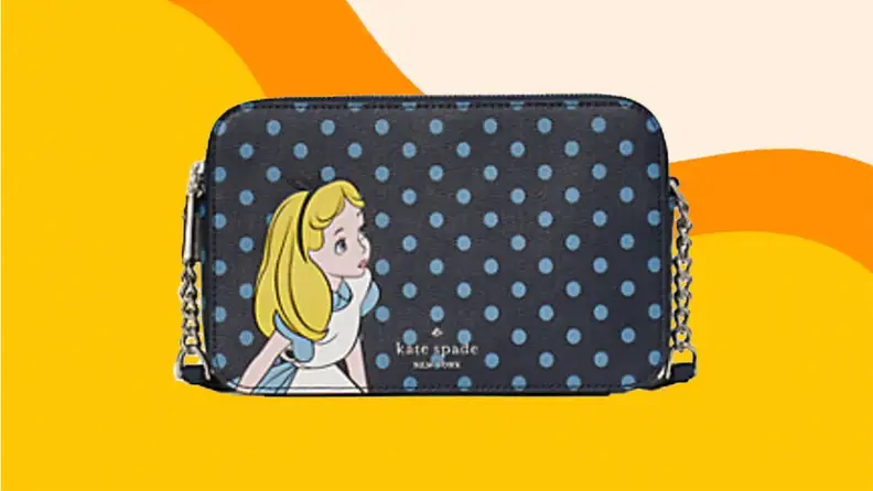 A black Alice in Wonderland themed crossbody bag against an orange background.