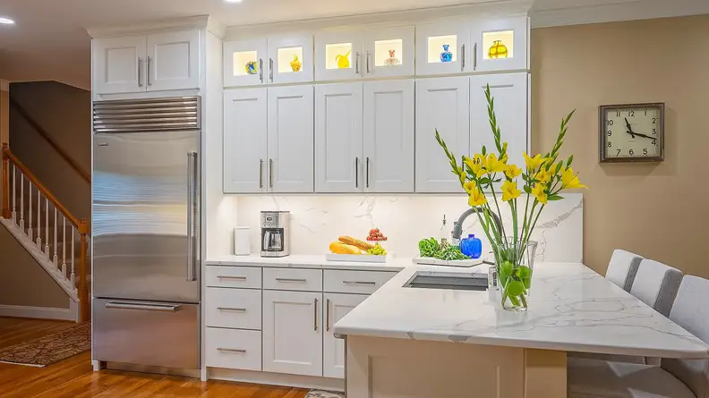 Extend your cabinets all the way to the ceiling for a more modern appearance.