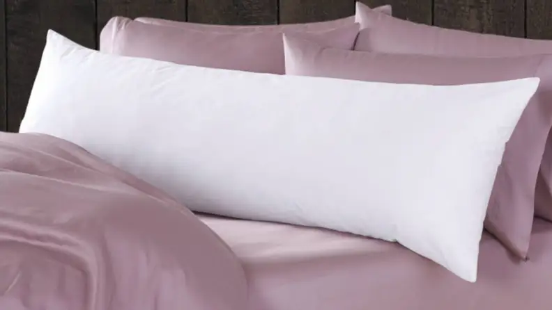 a body pillow on a bed