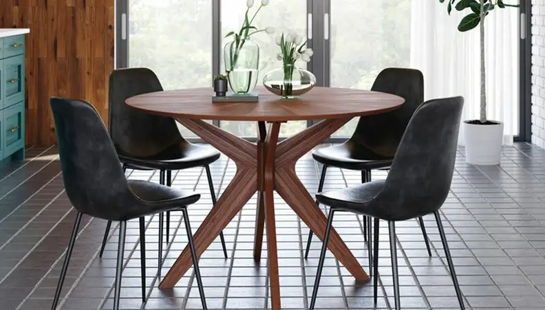 Wooden kitchen table with black chairs