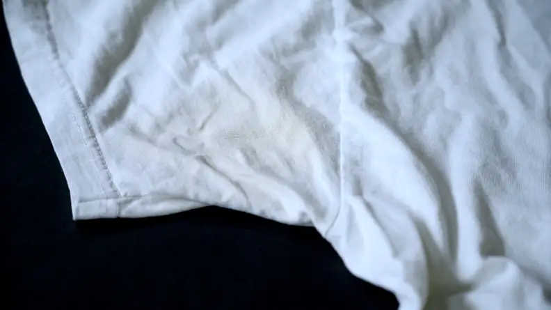 After using the baking soda paste on the pit stain on the left side of the shirt, the pit stain had noticeably faded.