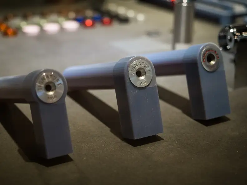 Prototypes of the roundels that KitchenAid's designers added to the caps of large appliance handles