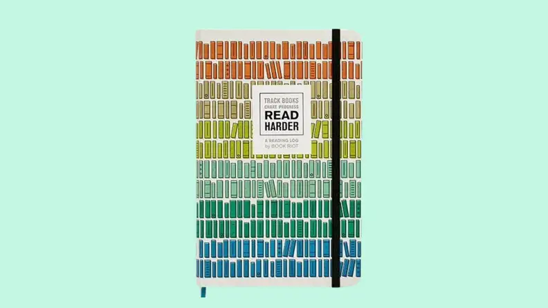 A colorful reading log journal on a green background.