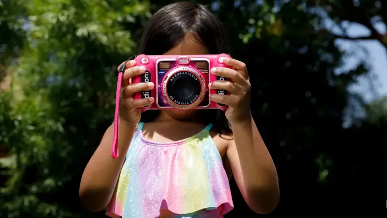 A child takes a photo with a KidiZoom camera