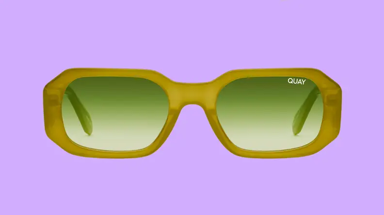 An image of a pair of lime green, narrow sunglasses with bright green lenses.