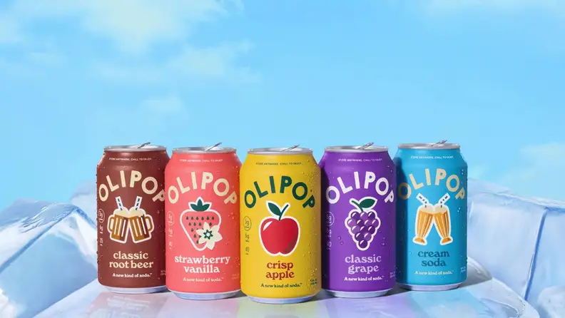 Row of Olipop soda cans in five flavors on ice