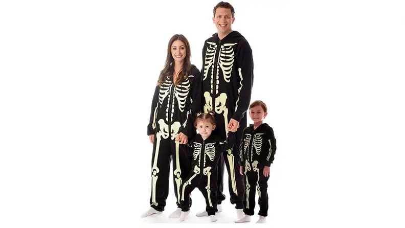 A family in glow-in the dark skeleton onesies.