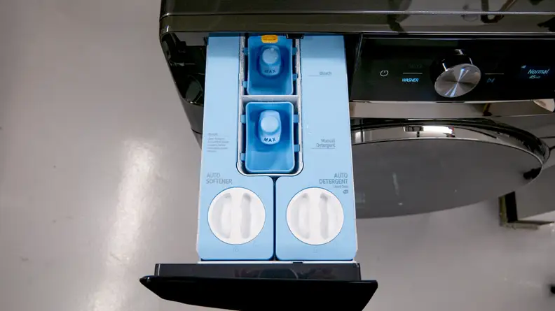 Close-up shot of the sliding dual detergent and softener compartment on the Samsung WF50A8800AV Front-load Washing Machine.