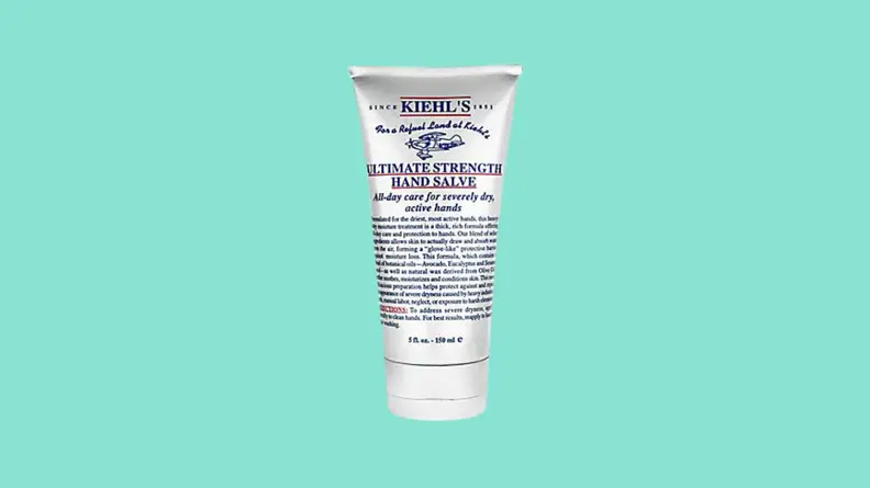 Tube of hand cream against teal background