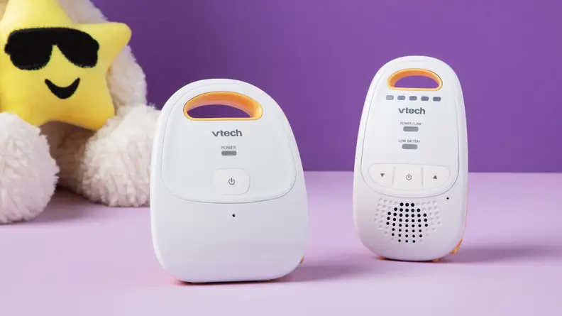 A V-Tech baby monitor with a cute star-shaped stuffy.