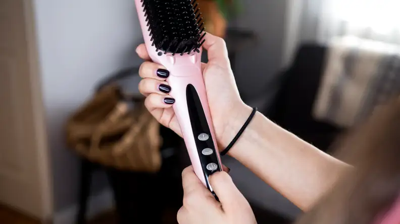 This top-selling Sephora thermal hair brush by Amika straightens my hair in half the time
