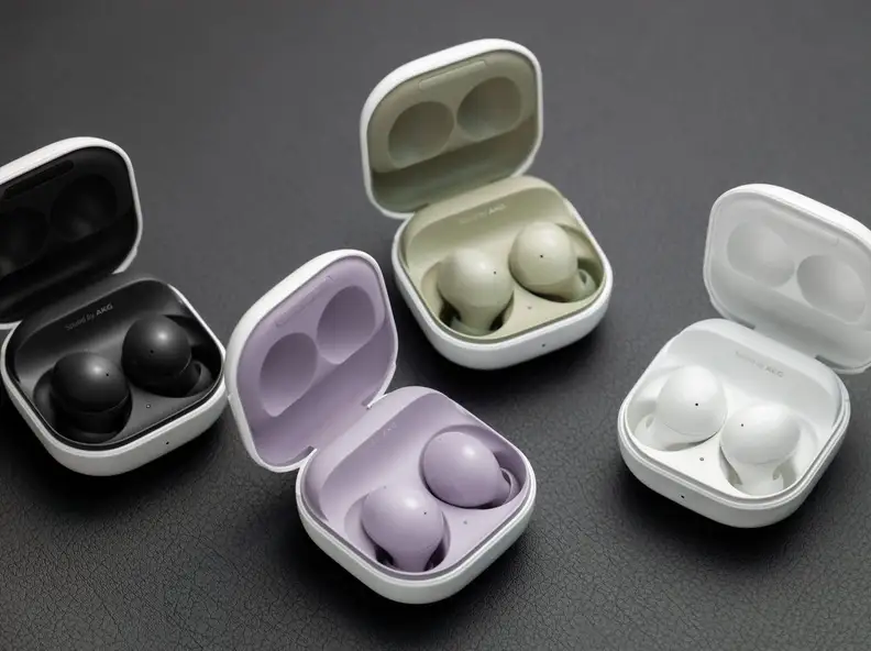 Multi-colored earbuds in their cases.