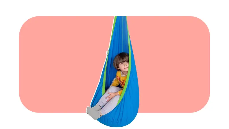 An Outree sensory swing on a colorful background