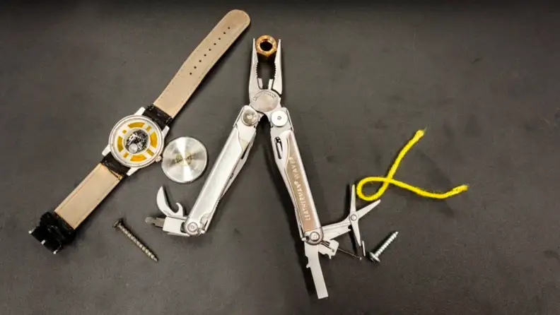 A multitool against a gray background.