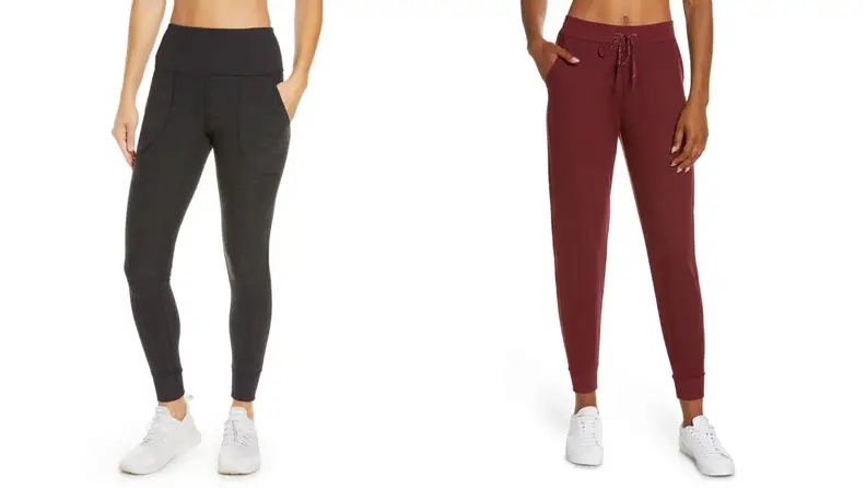 A woman wearing a pair of black Zella leggins and a woman wearing a pair of red Zella leggings.