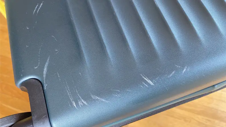 Exterior shot of hard suitcase shell on the Coolife luggage, showing a few scratches.