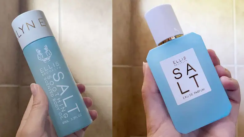 Person holding bottle of skincare bottles in hand.