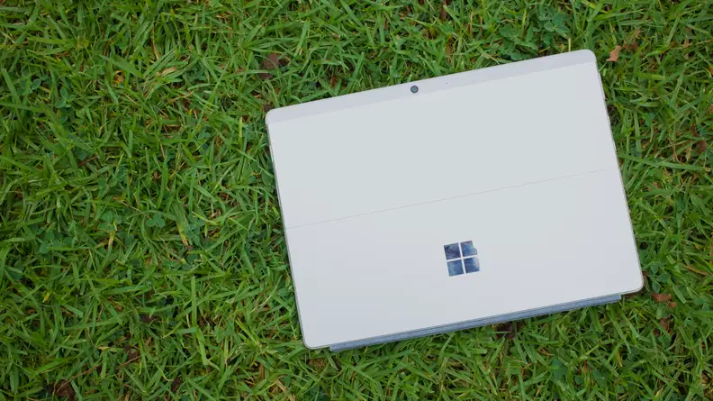 An overhead view of the back of the Surface Pro X, showing its kickstand and rear camera.