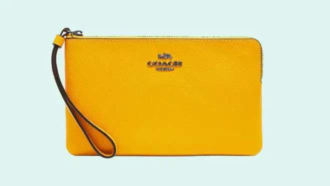 yellow wristlet from Coach Outlet