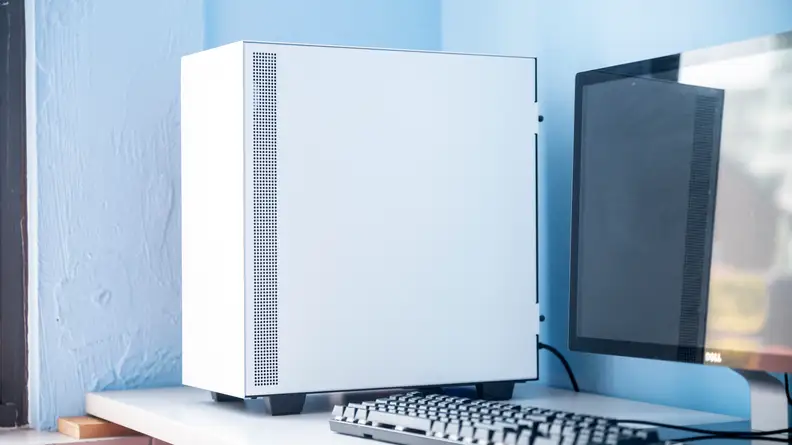 The PC sits on the left side of a desk