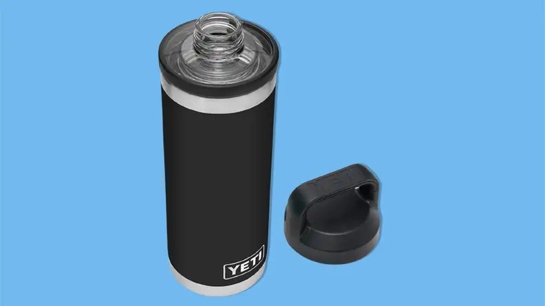 YETI Rambler vacuum insulated stainless steel bottle with Chug Cap on a blue background.