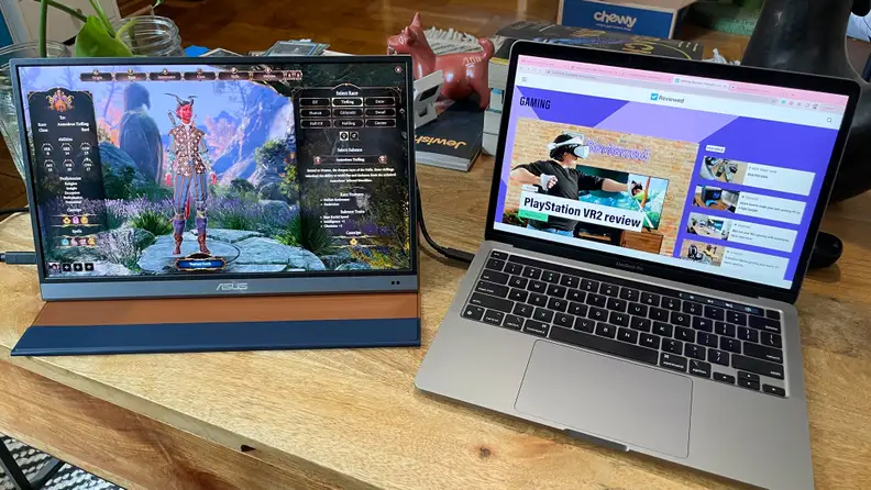 Two laptop monitors on a desk