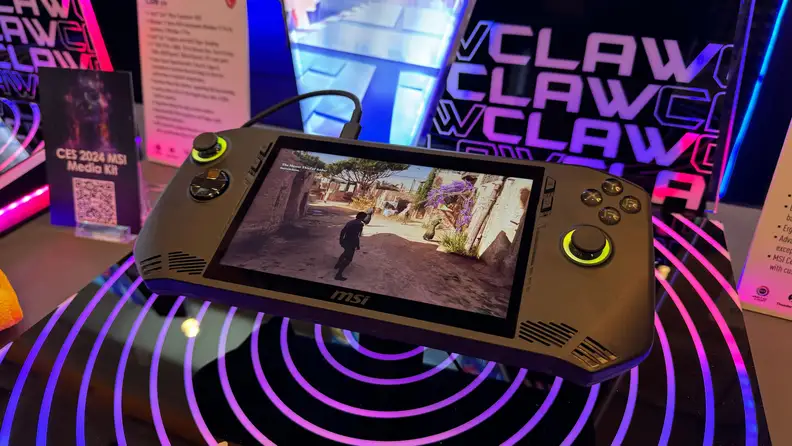 An MSI Claw on display in a vibrant purple setup at CES 2024.
