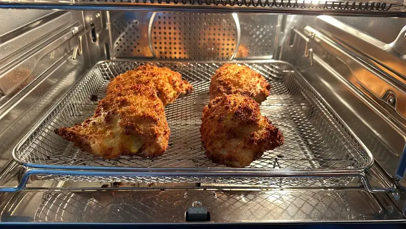 Cooked fried chicken inside the GE Profile smart oven.