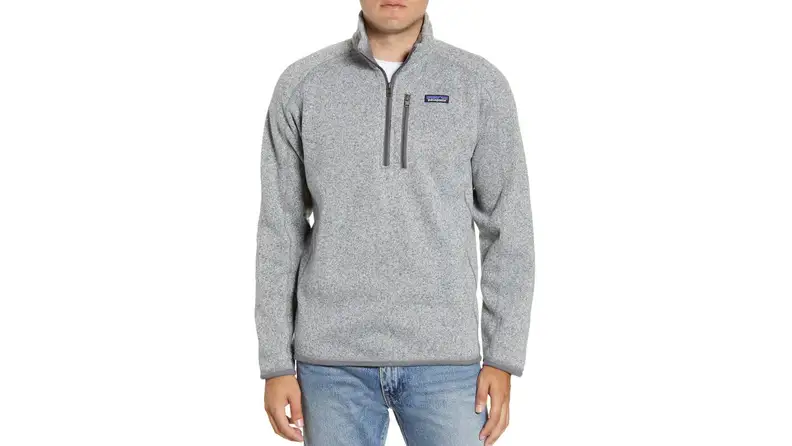 A person wears a gray sweater.
