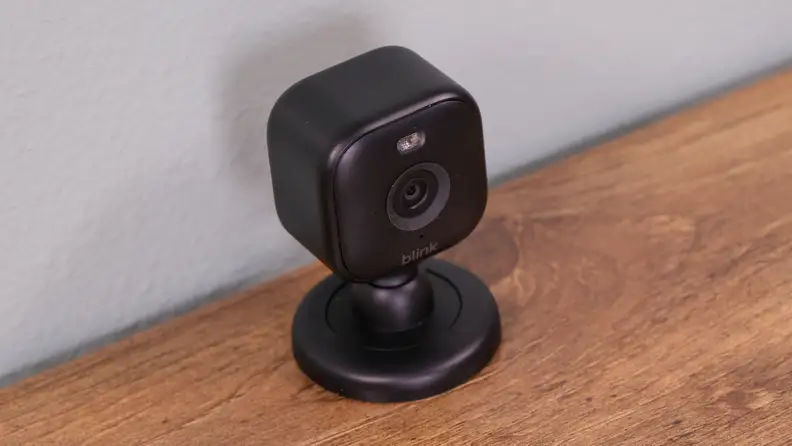 The Blink Mini 2 set up by a wall.