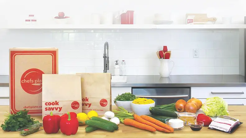 The Chefs Plate meal kit contents laid out on a table.