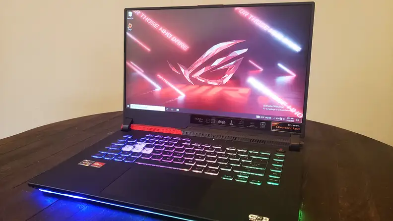 An open laptop sitting on top of a table