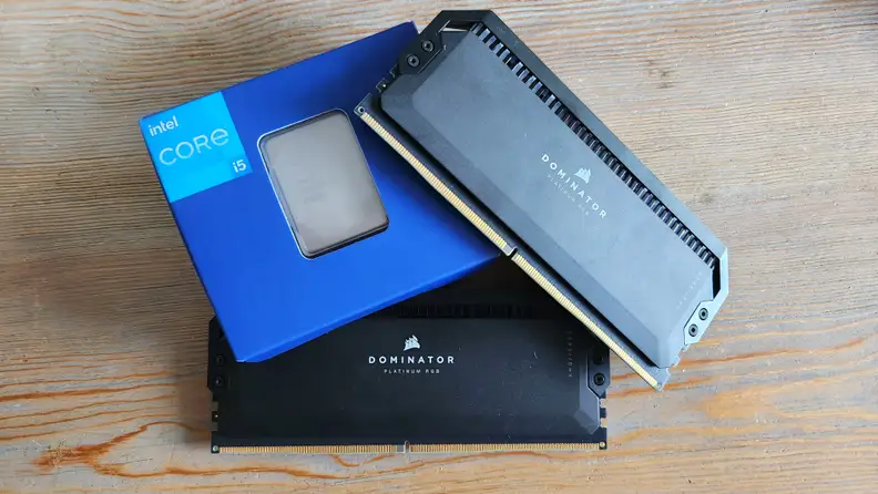 A small blue box in between two black sticks of desktop computer RAM.