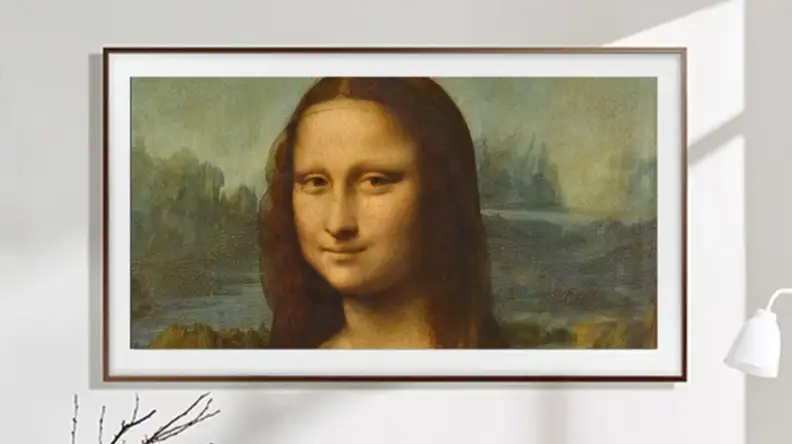 Television that looks like picture frame mounted on wall.