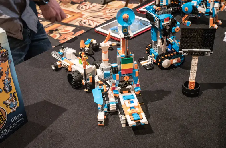 This robot can be programmed to build little models out of Legos.