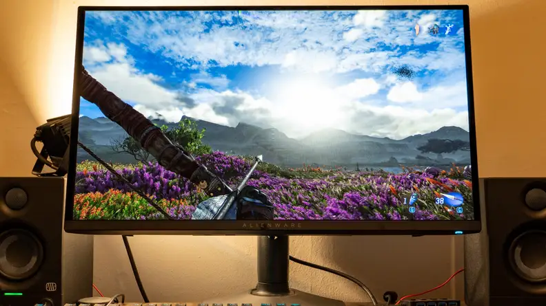 A gaming monitor with Pandora on screen and the sun